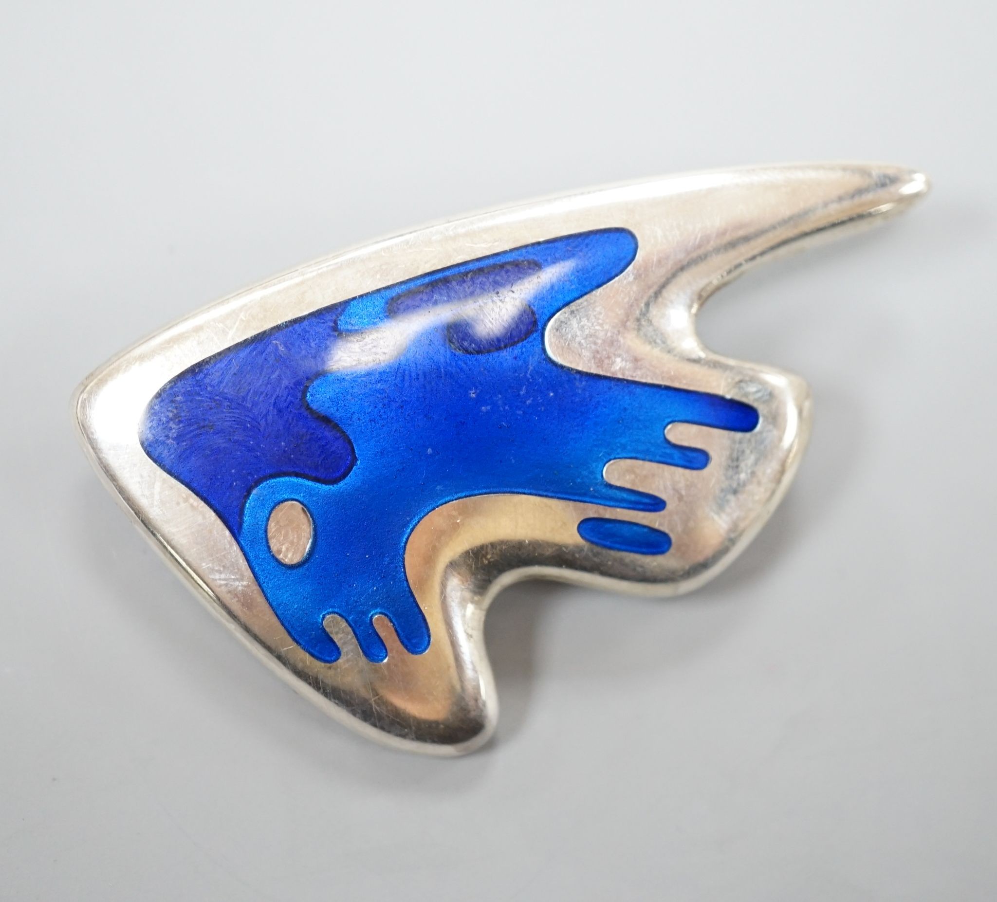 A Henning Koppel for Georg Jensen sterling and two colour blue enamel set stylised fish brooch, no. 307, 59mm.